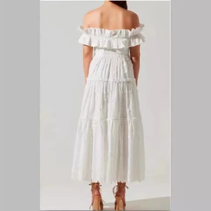 Elegant white off-shoulder lace maxi dress with ruffled layers and a split back design