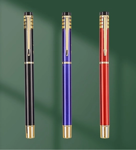 Detailed view of three metallic business pens in black blue and red with gold clips