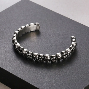 Macro shot of 9mm gothic skull link bracelet in vintage stainless steel finish