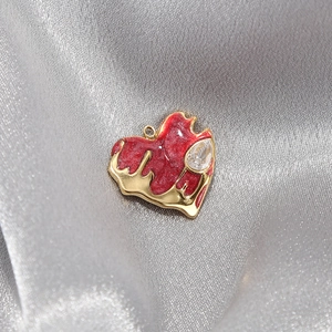 Sparkling red heart pendant in gold stainless steel with central pear-cut diamond