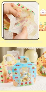 Christmas ziplock cookie bags featuring cute cartoon prints, handle, and clear window