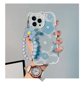 Detail of blue plumeria phone case with matching floral beaded charm bracelet