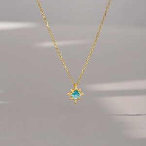 Luxury S925 silver necklace featuring a blue topaz octagonal star pendant in gold finish