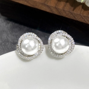 Elegant pearl stud earrings with micro-set zircon flowers in a wraparound silver design