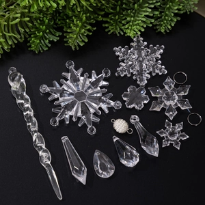 Acrylic Christmas tree ornaments set with clear snowflakes and icicles on black backdrop
