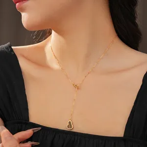 Adjustable Y-shape gold necklace with zircon-studded gourd pendant and tiger eye stone