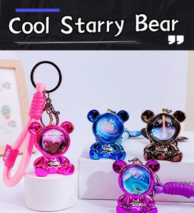 Detailed group shot of Cool Starry Bear keychains in rose, blue, bronze and purple colors