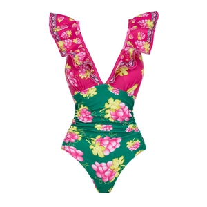 Detail of V-neck one-piece swimsuit with ruffled sleeves and tropical grape patterns