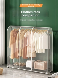 Close-up of a clear waterproof garment rack cover protecting clothes in a home setting