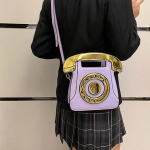 Detailed view of the purple PU crossbody bag shaped like a vintage telephone with sequins