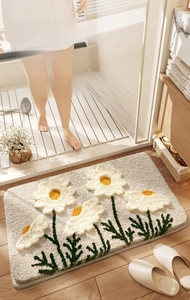 Close-up of thick floral bathroom mat showing dense microfiber flocking texture