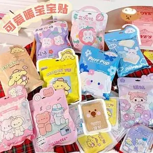 Close-up of cute cartoon portable hand warmers with colorful bear and bunny patterns