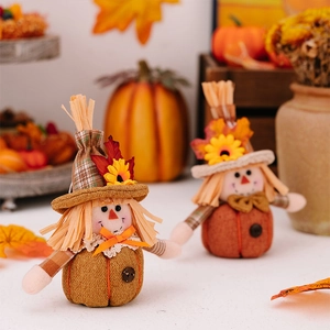 Close-up of autumn gnome dolls with pumpkin bases and plaid sleeves for harvest decor