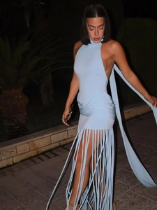 Detailed view of baby blue halter neck dress featuring long fringes and ruched back