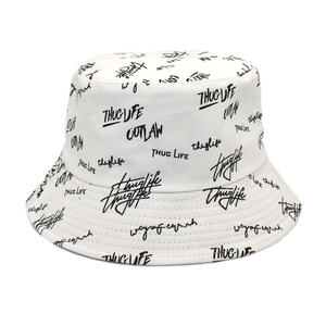 Bob en coton blanc réversible avec broderie de graffitis noirs pour la protection solaire