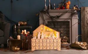 Detail of wooden advent calendar with LED Nativity scene and 24 countdown drawers