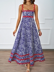 Close-up of purple leopard print maxi dress with distinctive red scalloped trim details