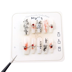 Bamboo ink style press-on nails set with red rhinestones and elegant calligraphy art