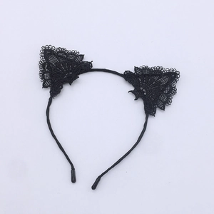 Close-up of black lace cat ears headband with multi-layered fabric and intricate patterns