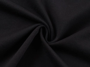 Close-up of black knitted fabric texture showing drape and professional stitching detail