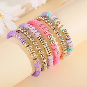Set of 6 bohemian elastic bracelets featuring colorful polymer clay heishi beads and gold accents