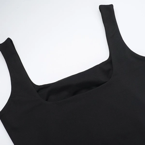 Close-up detail of black square neck tank top with wide straps and smooth fabric texture