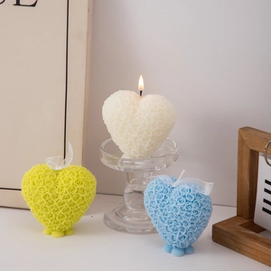 Scented heart-shaped rose relief candles in white, yellow, and blue colors