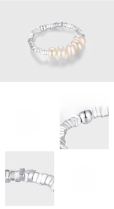 Detail of 925 sterling silver beaded ring with natural pearls and polished texture