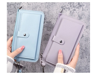 Detail view of long PU leather wallets with sturdy zippers and detachable wrist straps