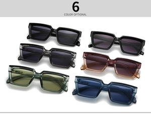 Flat lay display of rectangle sunglasses in six colors with thick frames and integrated pads