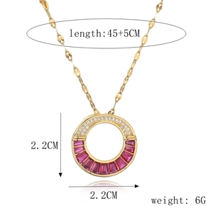 Detail of gold pendant necklace featuring white zircons and pink gemstone with size labels