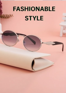 Detail of vintage oval metal sunglasses with purple gradient lenses and geometric temple