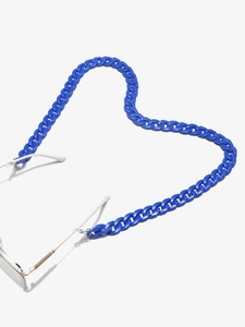 Detail of Klein Blue acrylic link glasses chain arranged in a heart shape on a clean white background