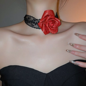 Close-up of elegant black lace choker with a 3D red rose flower on model neck