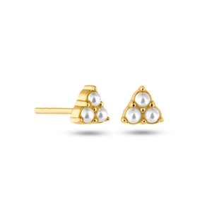 Detailed view of gold triangular stud earrings with three round white pearls on white background