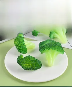 Macro shot of realistic artificial broccoli florets on a ceramic plate for food decor
