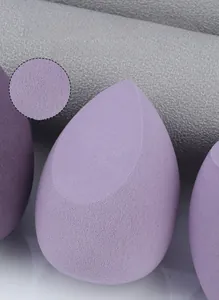 Macro shot of purple teardrop makeup sponge showing fine pores and soft texture detail