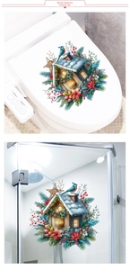 Detailed Christmas snow cabin and bluebird stickers applied to a bathroom glass door
