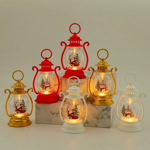 Detail of Christmas lantern with LED light featuring Santa Claus and snowman patterns
