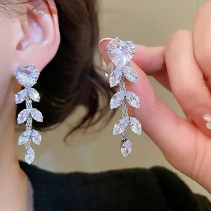 Elegant silver zircon tassel earrings with heart and leaf shaped stones in a drop design