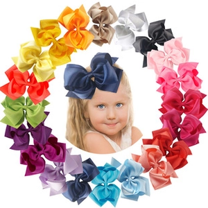 Detailed set of 20 colorful ribbon bow hair clips for girls with child model preview
