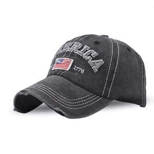 Close-up of distressed brim and 1776 America embroidery on washed baseball cap
