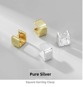 Macro detail of geometric square silver and gold earrings with pure silver hallmark