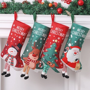 Set of four Christmas stockings with 3D Santa and Reindeer hanging on a festive fireplace
