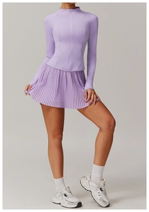 Detail of lavender athletic set featuring high-stretch zip-up jacket and pleated skirt