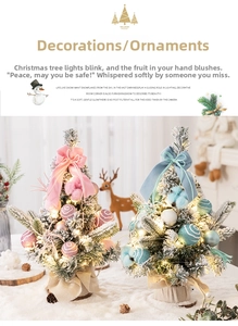 Detail of pink flocked mini Christmas tree with LED lights and ribbon on burlap base