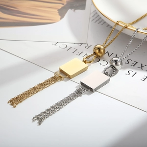 Detail of adjustable geometric fringe necklaces in gold and silver stainless steel finish