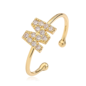 Detailed view of gold-plated open ring featuring a micro-pave cubic zirconia letter M