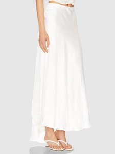 Close-up of elegant white satin midi skirt with lace trim and glossy silk texture
