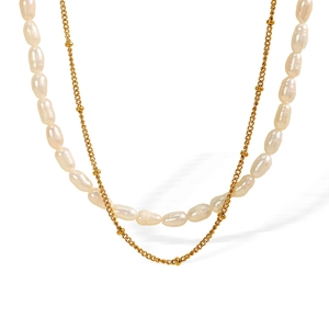 Elegant double-layer necklace with white baroque pearls and a rose embossed pendant